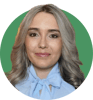 Headshot of Alicia Sacristan on a green background