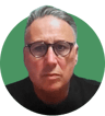 Headshot of Chris Harman on a green background