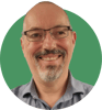 Headshot of David Cornfield on a green background