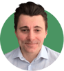 Headshot of Anton Medvedev on a green background