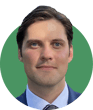Headshot of Jack Mahoney on a green background