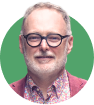 Headshot of John Power on a green background