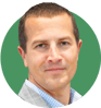 Headshot of Mark Erdmann on a green background