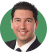 Headshot of Michael Iannuzzi on a green background