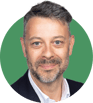 Headshot of Nicolas Herman on a green background